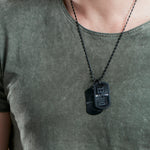 Gent wearing DIESEL JEWELS Mod. STEEL necklace in stainless steel, featuring official Diesel logo. Packaged in official box.