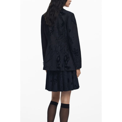 Back view of Desigual Black Polyester Women Jacket with floral design, showcasing the chic V-neck and stylish silhouette.