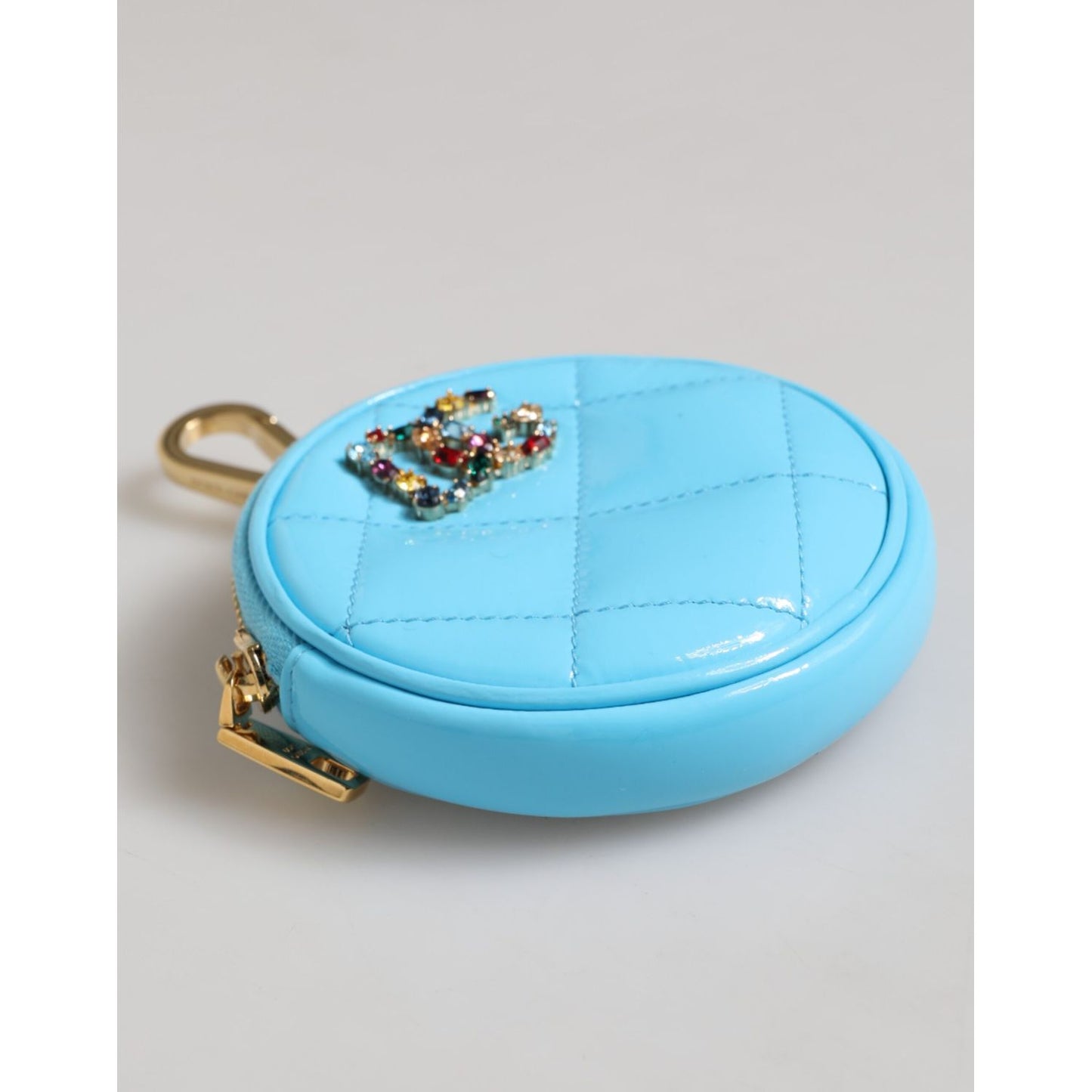 Dolce & Gabbana Azure Blue Leather Round Coin Purse Keychain Crystal Logo Wallet in quilted patent leather with gold hardware.