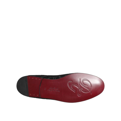 Sole view of Dolce & Gabbana Black Brocade Loafers Slip On Men Dress Shoes, featuring embossed logo and red finish for a sophisticated touch.