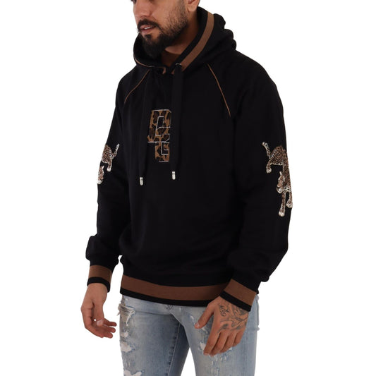 Model wearing Dolce & Gabbana Black Brown Leopard Cotton Hooded Pullover Sweater, featuring leopard details and made in Italy.