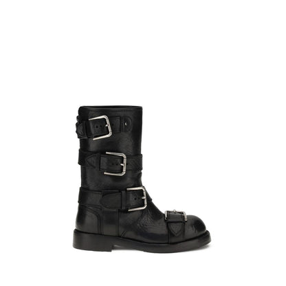 Dolce & Gabbana Black Calf Leather Bos Taurus Lace-Up Boots with buckles and palladium plating, leather sole, and logo tag detail.