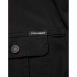 Close-up of Dolce & Gabbana Black Cotton Denim Stretch Giubbotto Jacket showing button and logo details.