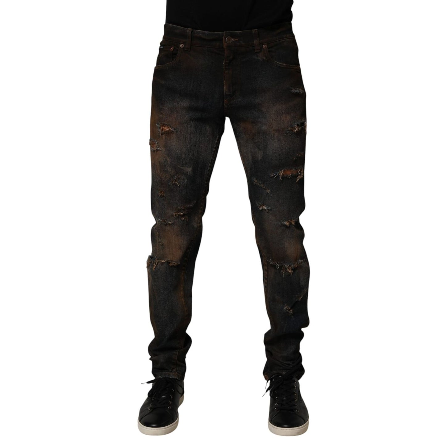 Dolce & Gabbana Black Cotton Skinny Tattered Men Denim Jeans with artful distressing, shown against a white background.
