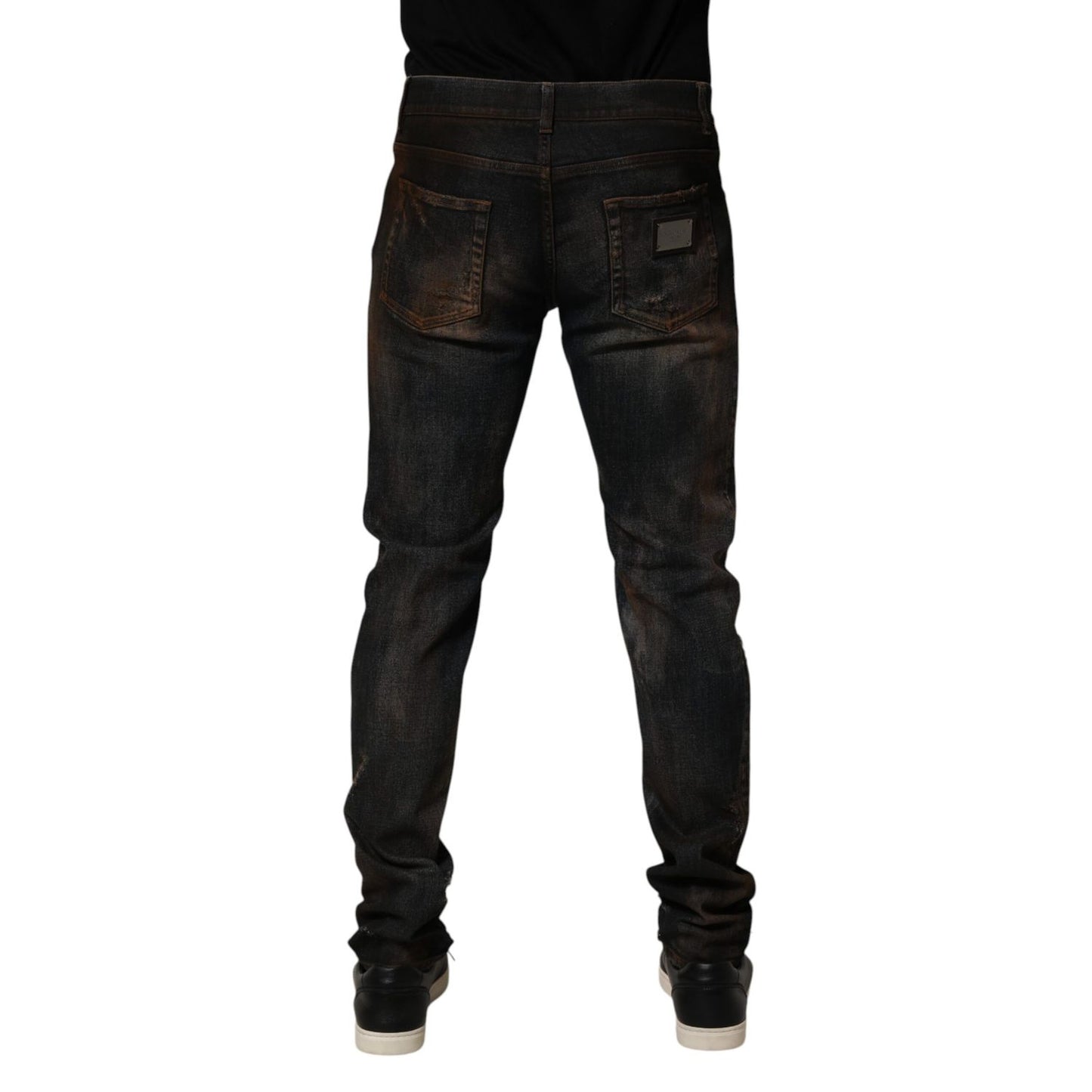 Back view of Dolce & Gabbana Black Cotton Skinny Tattered Men Denim Jeans showcasing sleek design and modern style.