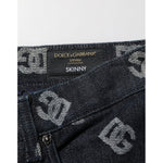 Close-up of Dolce & Gabbana Black DG Monogram Cotton Skinny Denim Jeans showcasing the label and DG monogram design.