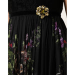 Close-up of Dolce & Gabbana Black Floral Key Print Crystal Strapless Dress with brooch detail.