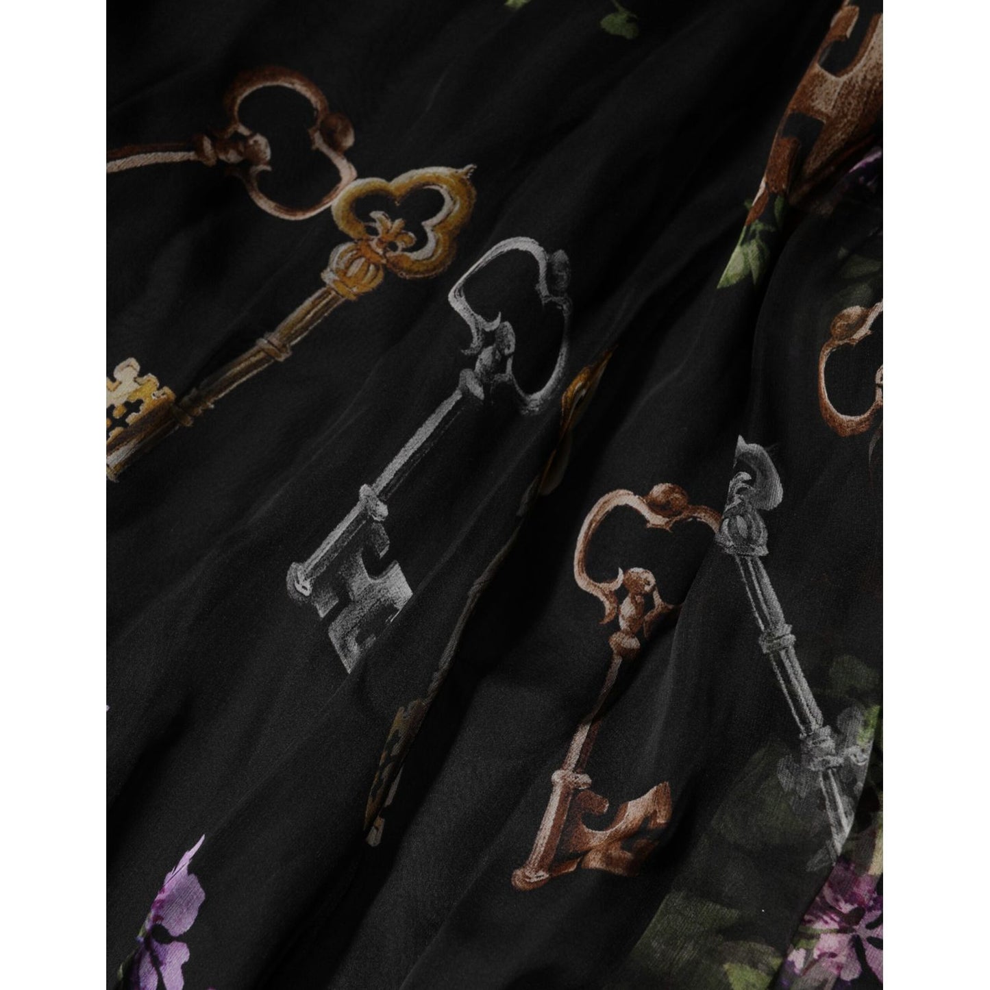 Close-up of Dolce & Gabbana Black Floral Key Print Crystal Strapless Dress showcasing intricate key print on black chiffon fabric.