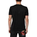 Back view of man wearing Dolce & Gabbana Black Goodluck 2021 Cotton Crew Neck T-shirt with rose embroidery on black jeans.