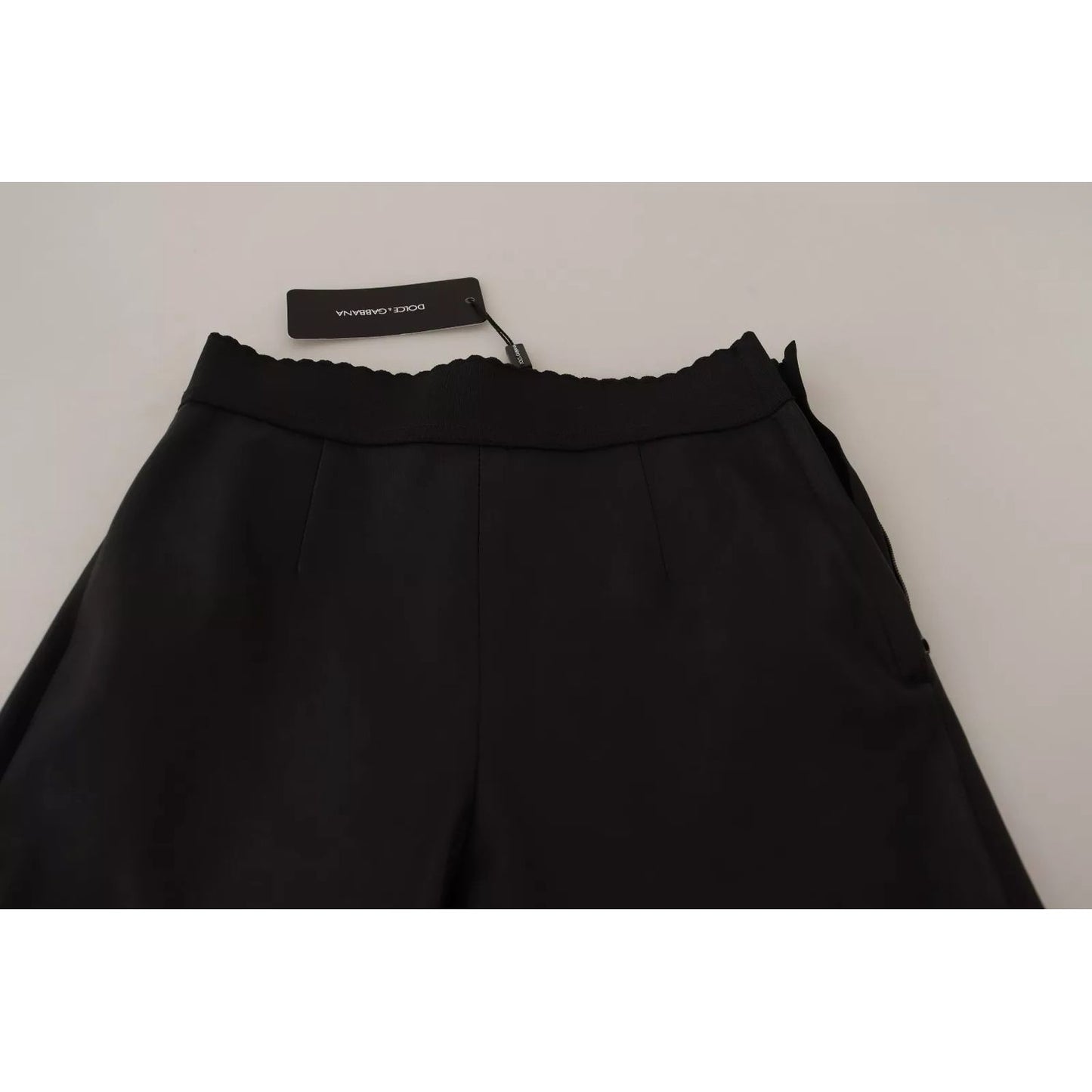 Dolce & Gabbana Black Leather Elastic Waist Trouser Pants with tags, repaired rip, slim fit style.