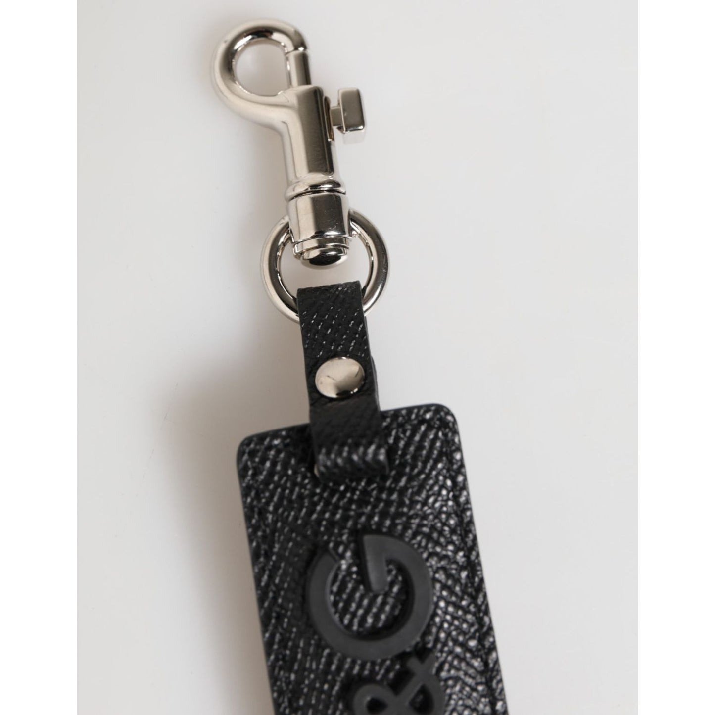 Dolce & Gabbana Black Leather Logo Metal Ring Keychain Holder Keyring with silver clasp on white background