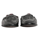 Dolce & Gabbana Black Leather Slip On Men Flat Loafers Shoes front view with logo details and leather sole, preowned condition.