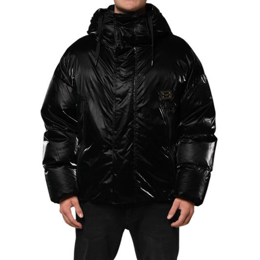 Dolce & Gabbana Black Logo Full Zip Hooded Quilted Jacket with ribbed hem and cuffs, sleek design, and distinctive logo details.
