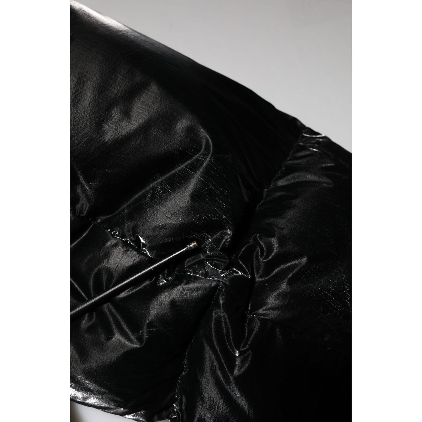 Close-up of Dolce & Gabbana Black Logo Full Zip Hooded Quilted Jacket showcasing the sleek black quilted material and design details.