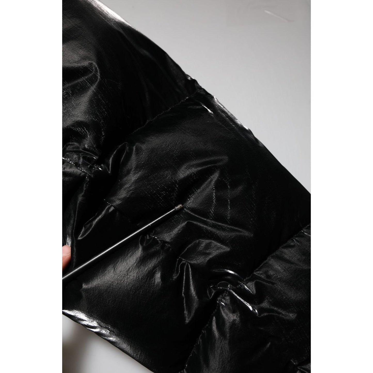 Close-up of Dolce & Gabbana Black Logo Full Zip Hooded Quilted Jacket with sleek quilted texture.