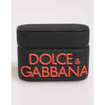 Dolce & Gabbana Black Orange Rubber Logo Embossed Accessory Airpods Case with embossed DG branding on black background.