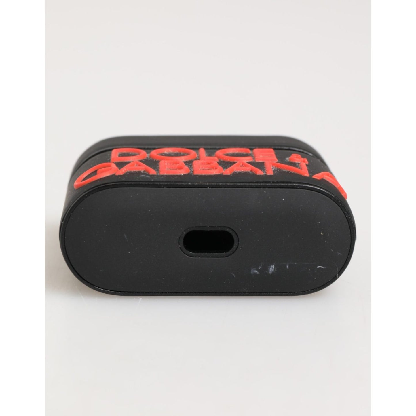 Dolce & Gabbana Black Orange Rubber Logo Embossed Accessory Airpods Case showing embossed DG logo.