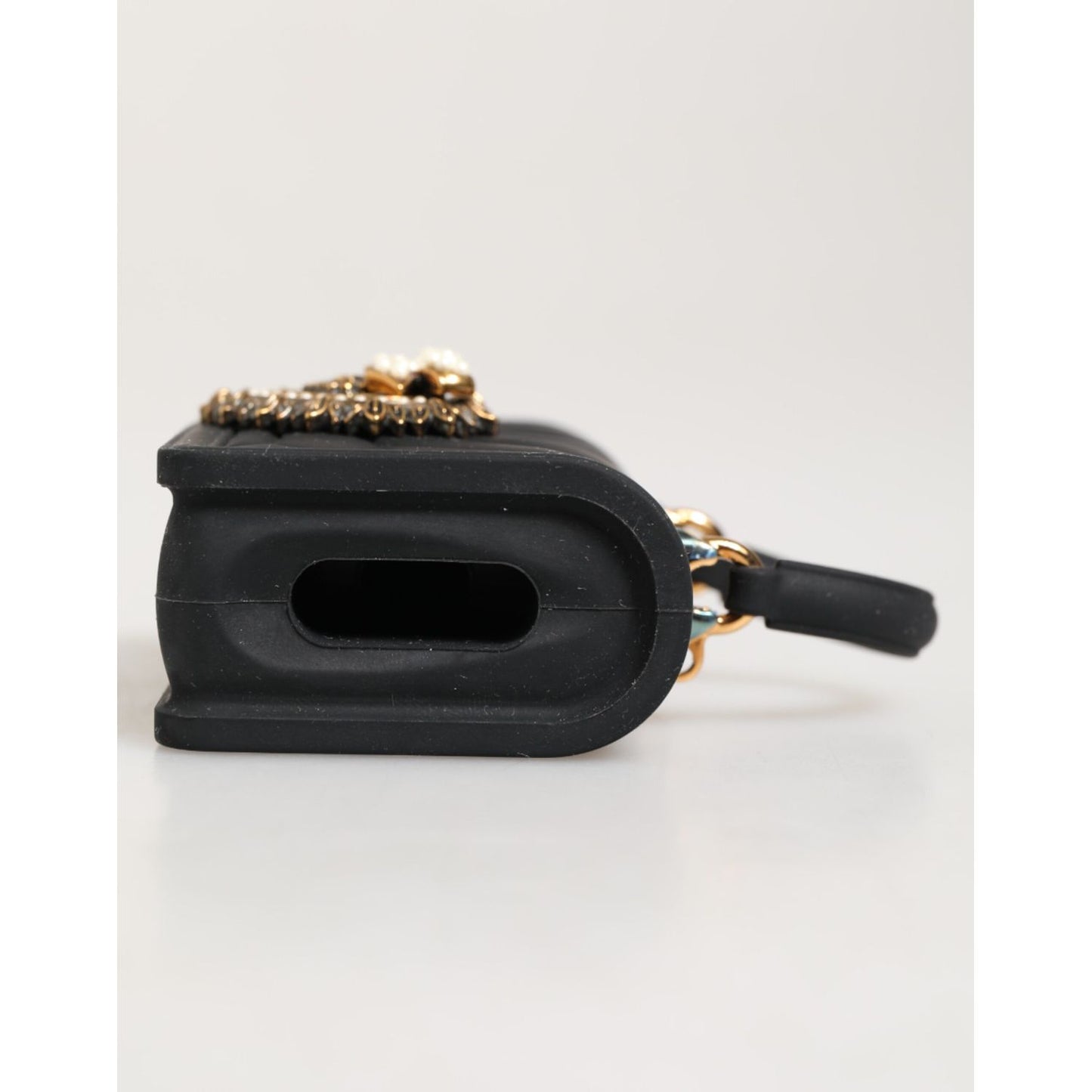 Side view of Dolce & Gabbana Black Silicone Devotion Heart Cover Hand Bag Airpod Case with gold detailing.