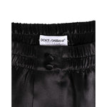 Dolce & Gabbana Black Silk Satin Elastic Men Boxer Short Swimwear with logo and button detail.