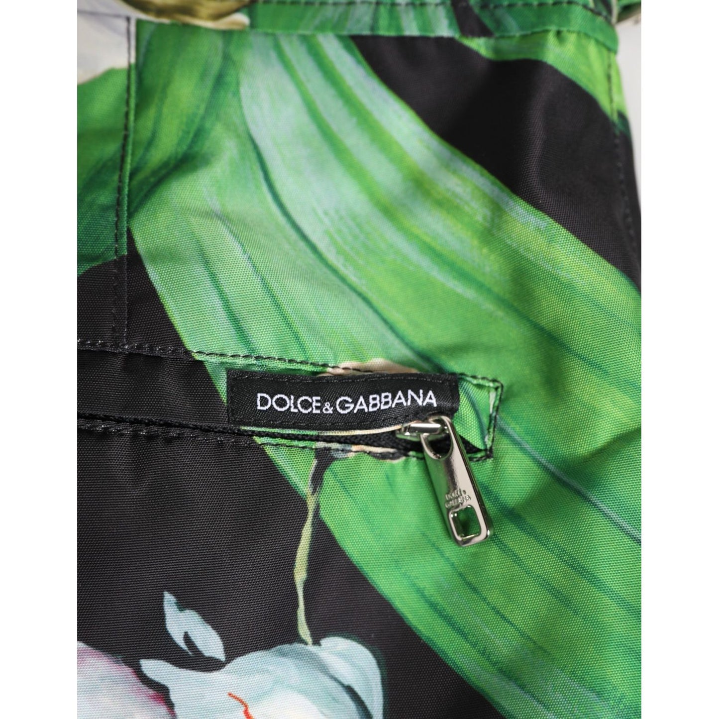 Dolce & Gabbana Black White Polyester Floral Orchid Print Shorts with zipper detail and logo tag.