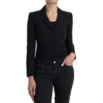 Dolce & Gabbana Black Wool Single Breasted Cropped Jacket on model, featuring notch lapels and flap pockets.