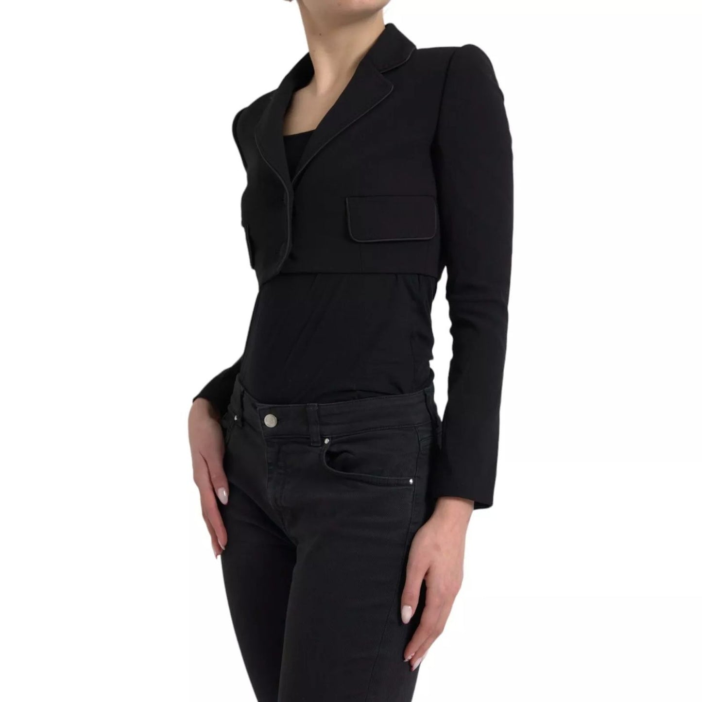 Model wearing Dolce & Gabbana Black Wool Single Breasted Cropped Jacket with notch lapels and front pockets, made in Italy.