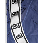 Close-up of Dolce & Gabbana Blue Nylon Straight Jogger Sweatpants Pants with logo detailing on the side.