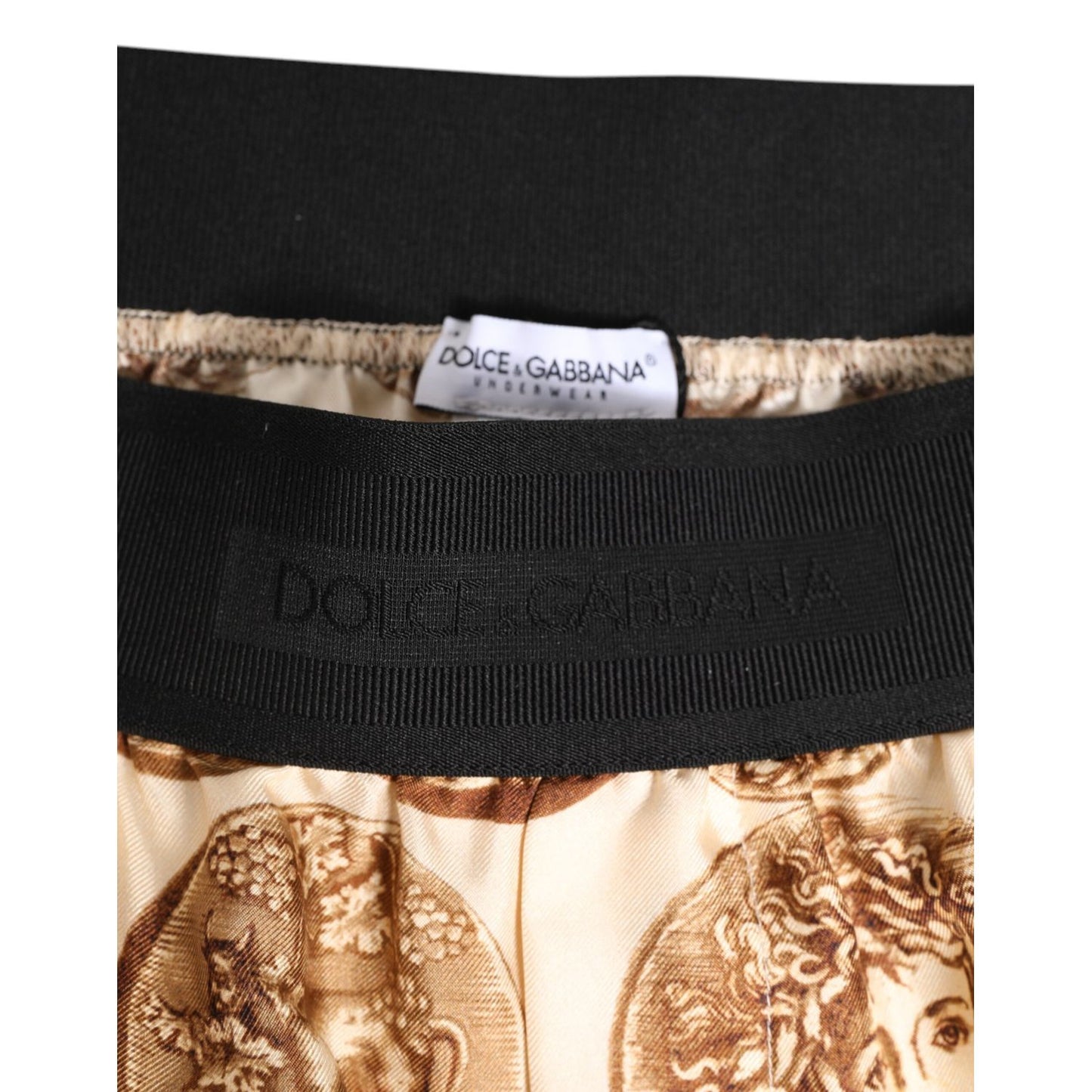 Dolce & Gabbana Brown Ancient Coin Print Silk Shorts Swimwear close-up of waistband and coin print design.
