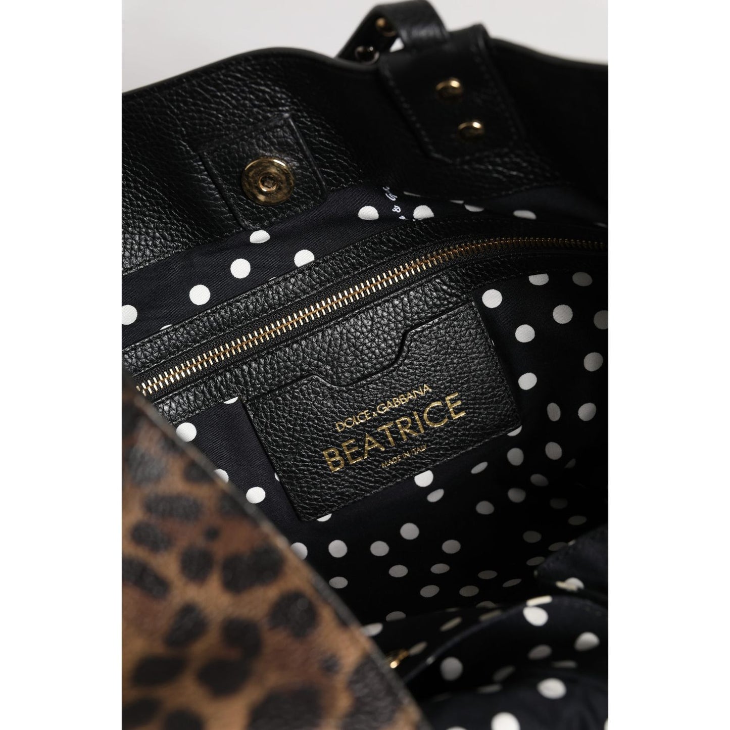 Interior view of Dolce & Gabbana Brown Leopard BEATRICE Leather Logo Plaque Tote Bag with polka dot lining and zipper pocket