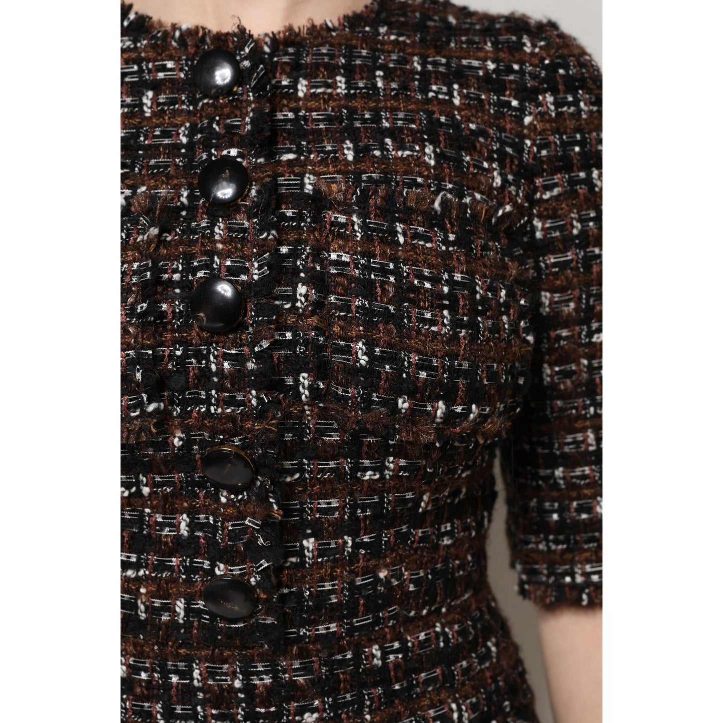 Close-up of Dolce & Gabbana Brown Tweed Short Sleeves A-line Mini Dress with button details.