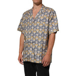 Dolce & Gabbana Cream Cotton Silk Hawaii Scallop Shell Print Shirt on mannequin, showcasing tropical style with elegant pattern.