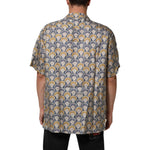 Back view of Dolce & Gabbana Cream Cotton Silk Hawaii Scallop Shell Print Shirt featuring a tropical design, perfect for summer wear.