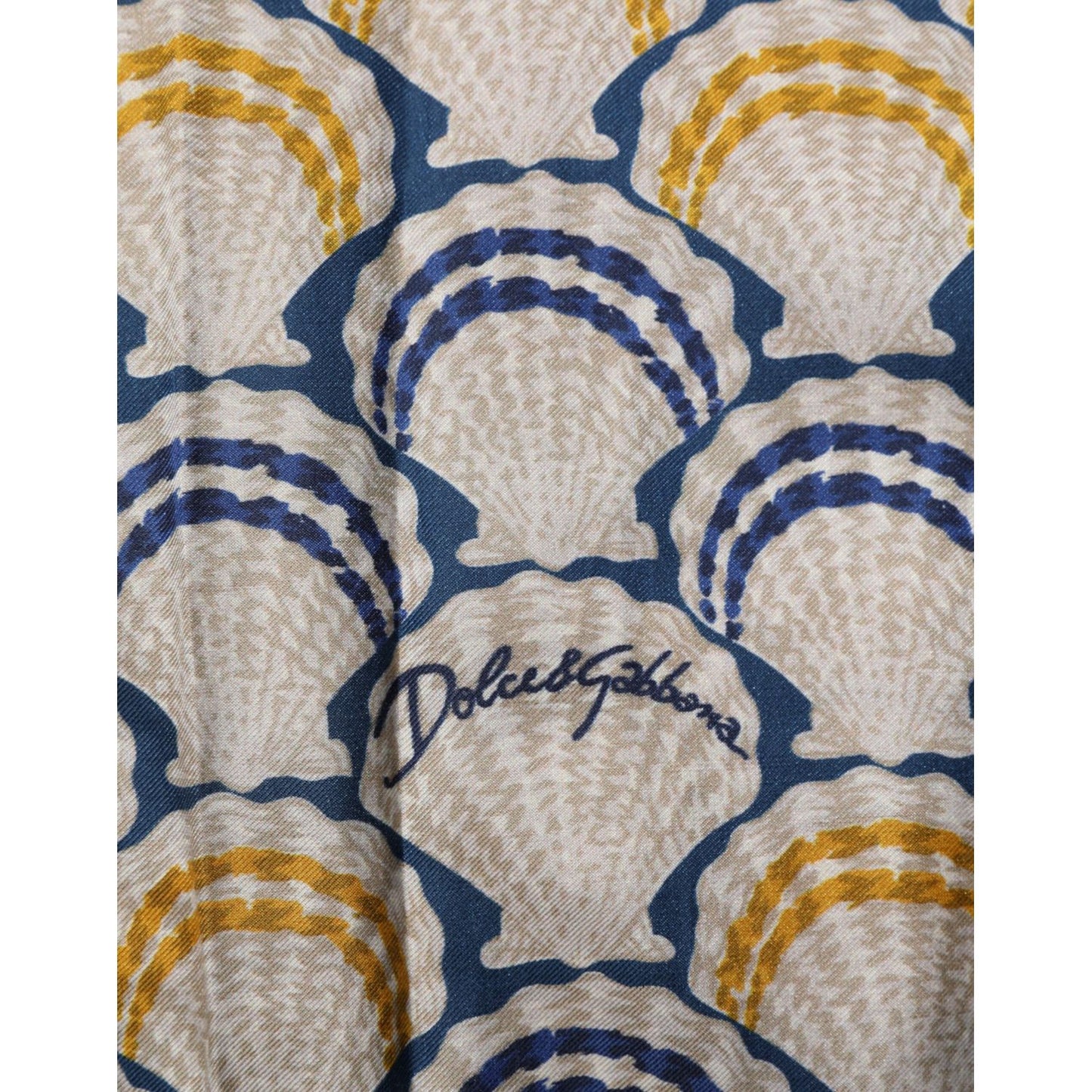 Dolce & Gabbana Cream Cotton Silk Hawaii Scallop Shell Print Shirt fabric detail with elegant shell pattern.
