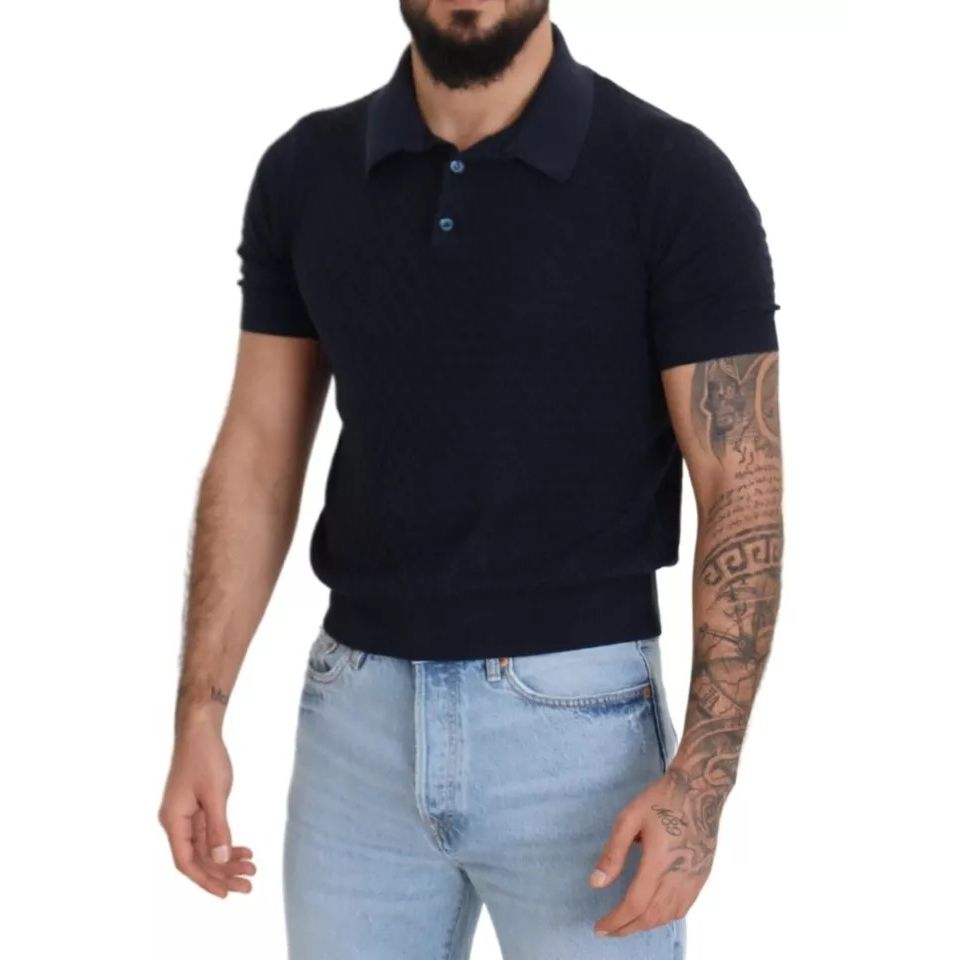 Man wearing Dolce & Gabbana Dark Blue Collared Polo Casual Silk T-shirt with short sleeves and tattooed arms.