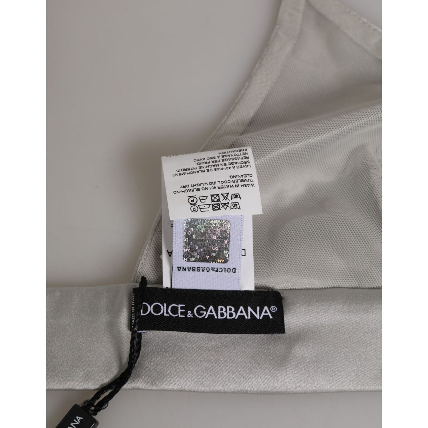 Close-up of Dolce & Gabbana Gray Silk Satin Triangle Soft Cup Bra Underwear with tag and logo details.