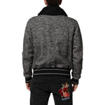 Back view of a Dolce & Gabbana Gray Wool Herringbone Shearling Collar Bomber Jacket with black shearling collar and ribbed cuffs.