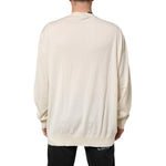 Back view of Dolce & Gabbana Ivory Virgin Wool Men V-Neck Knit Sweater showing ivory color and lightweight fabric.