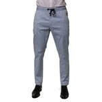 Dolce & Gabbana Light Blue Cotton Drawstring Elastic Waist Men Pants with slim tailored fit, shown with black shoes and white shirt.