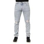 Dolce & Gabbana Light Blue Distressed Slim Fit Ripped Denim Jeans on model showcasing the trendy edgy design.