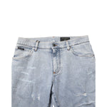 Close-up of Dolce & Gabbana Light Blue Distressed Slim Fit Ripped Denim Jeans with five-pocket design and distressed details.