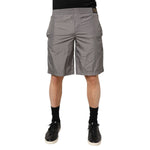 Model wearing Dolce & Gabbana Light Gray Nylon Elastic Waist Shorts Swimwear, showcasing sleek and minimalist Italian craftsmanship.