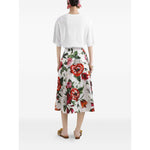 Rear view of a person wearing a white short-sleeve Dolce & Gabbana Logo cotton t-shirt and a floral print skirt, standing on a white background.