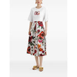 Woman wearing a Dolce & Gabbana Logo cotton t-shirt with white crew neck, short sleeves, and floral skirt