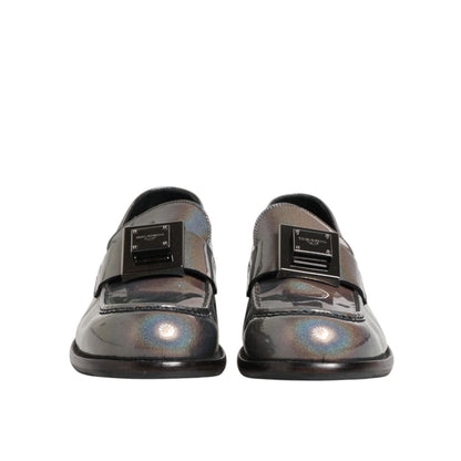 Front view of Dolce & Gabbana Metallic Silver Logo Slip On Men Dress Shoes with DG logo detail.