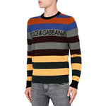 Man wearing Dolce & Gabbana Multicolor Cashmere Sweater with striped print and logo lettering on chest.