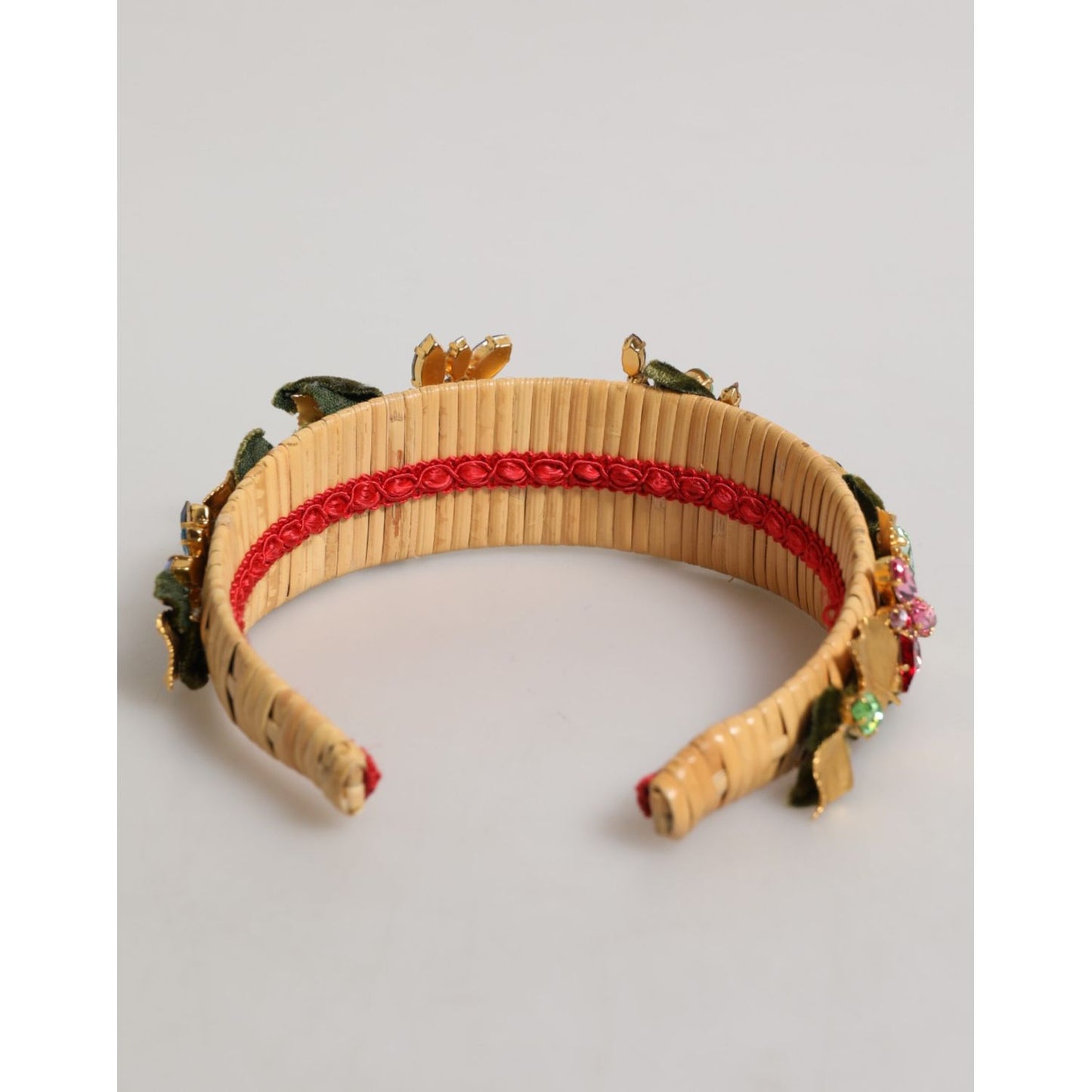 Close-up of Dolce & Gabbana Multicolor Crystal Floral Gold Green Velvet Crown Headband with woven base and crystal embellishments.