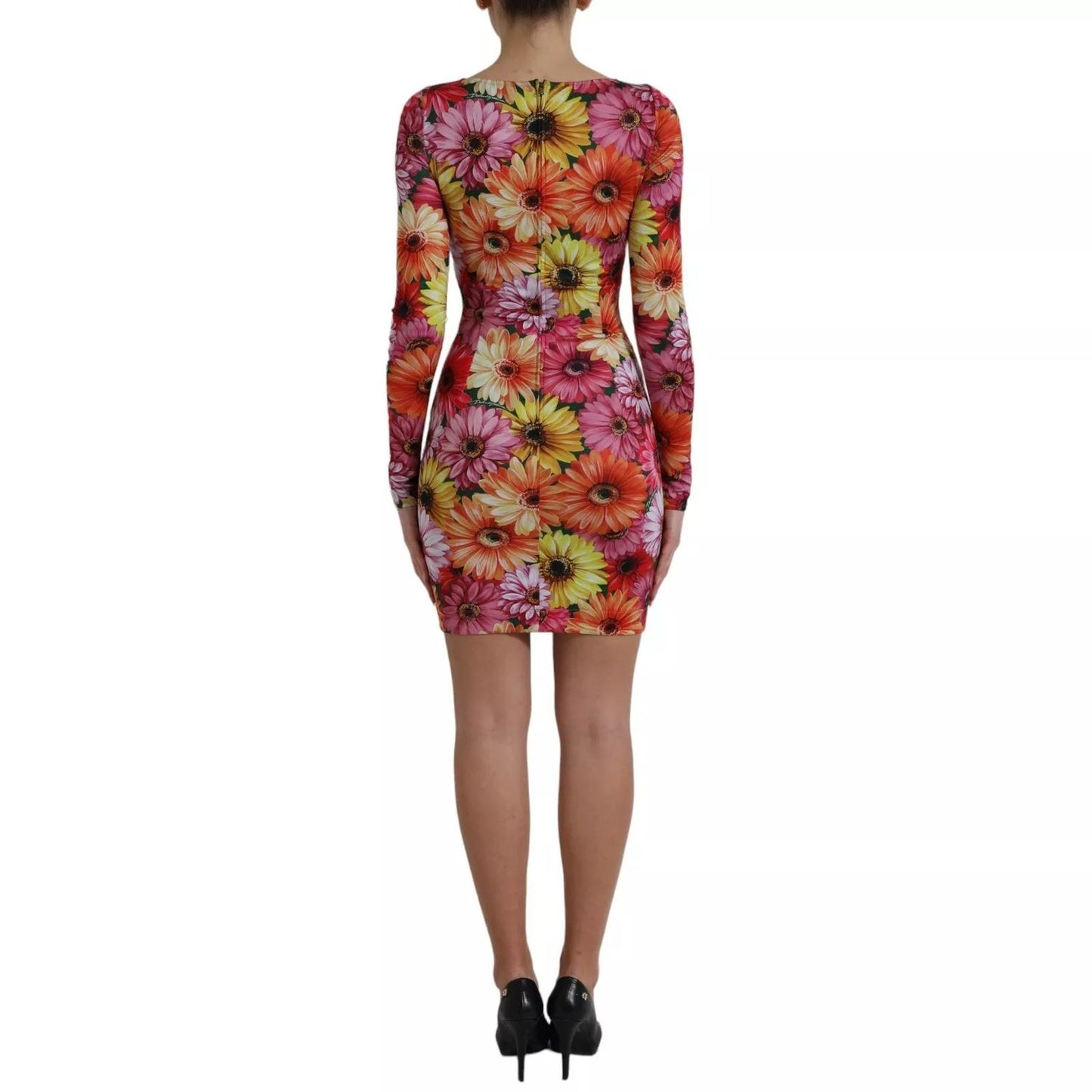 Back view of Dolce & Gabbana Multicolor Floral Print Sheath Mini Dress with model wearing the vibrant floral patterned dress.