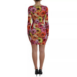 Back view of Dolce & Gabbana Multicolor Floral Print Sheath Mini Dress with model wearing the vibrant floral patterned dress.