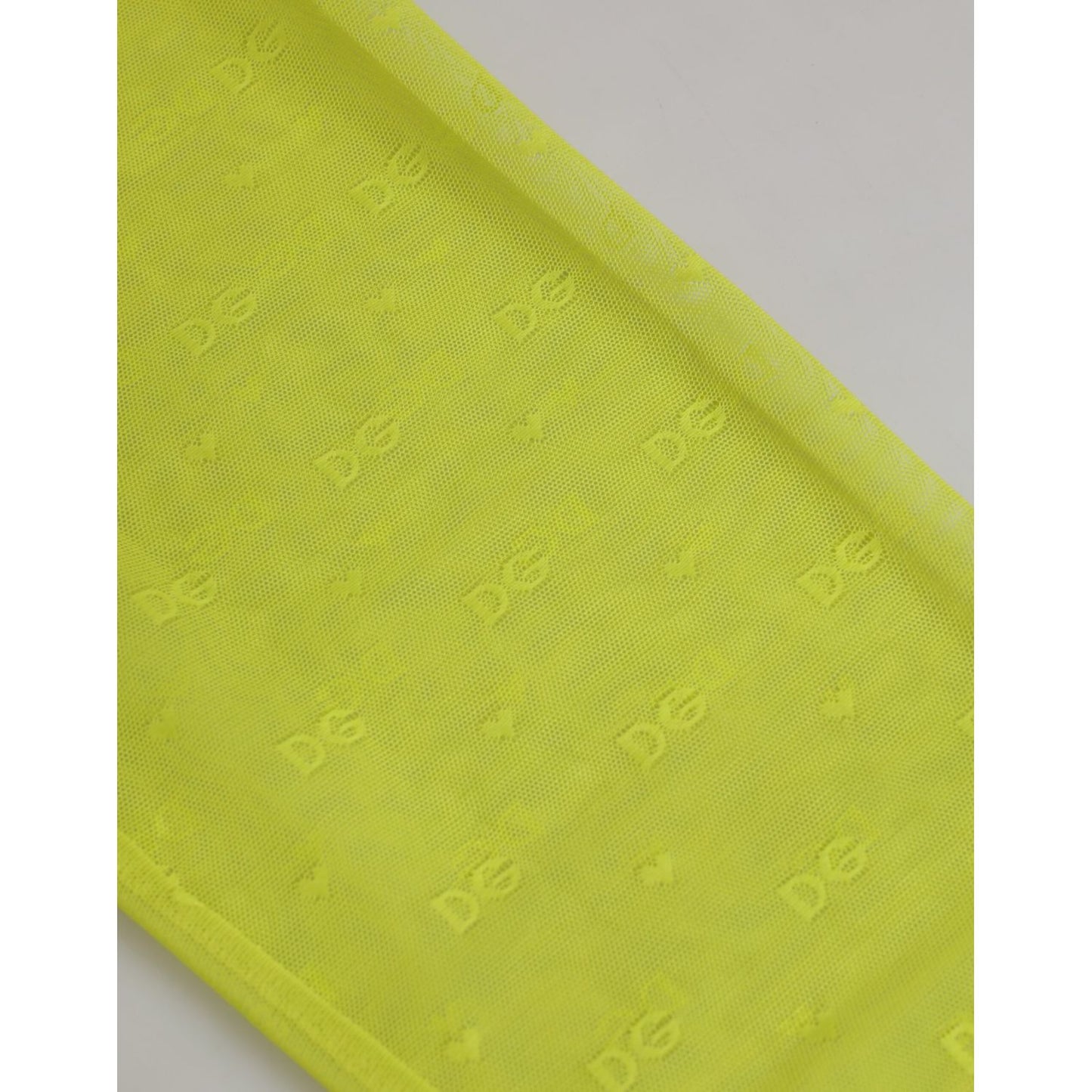 Close-up of Dolce & Gabbana Neon Green Nylon Logo Lace Leggings Pants Underwear showcasing DG logo and lace detail.