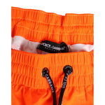 Dolce & Gabbana Orange Polyester Beachwear Men Shorts Swimwear with drawstring waistband and logo detail